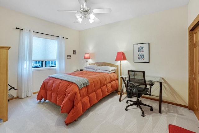 bedroom featuring ceiling fan and light carpet