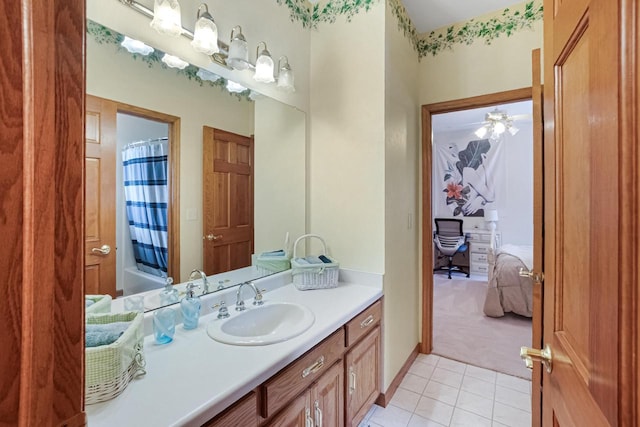 bathroom with vanity, shower / bathtub combination with curtain, and tile patterned flooring