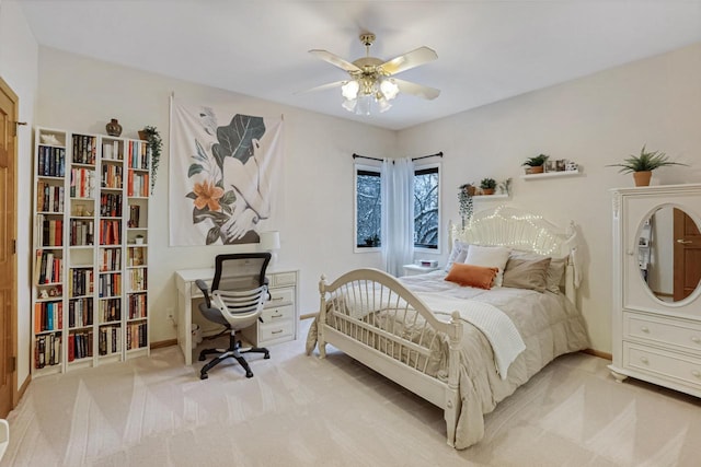 bedroom with light carpet and ceiling fan