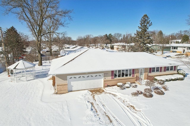 ranch-style house featuring a garage