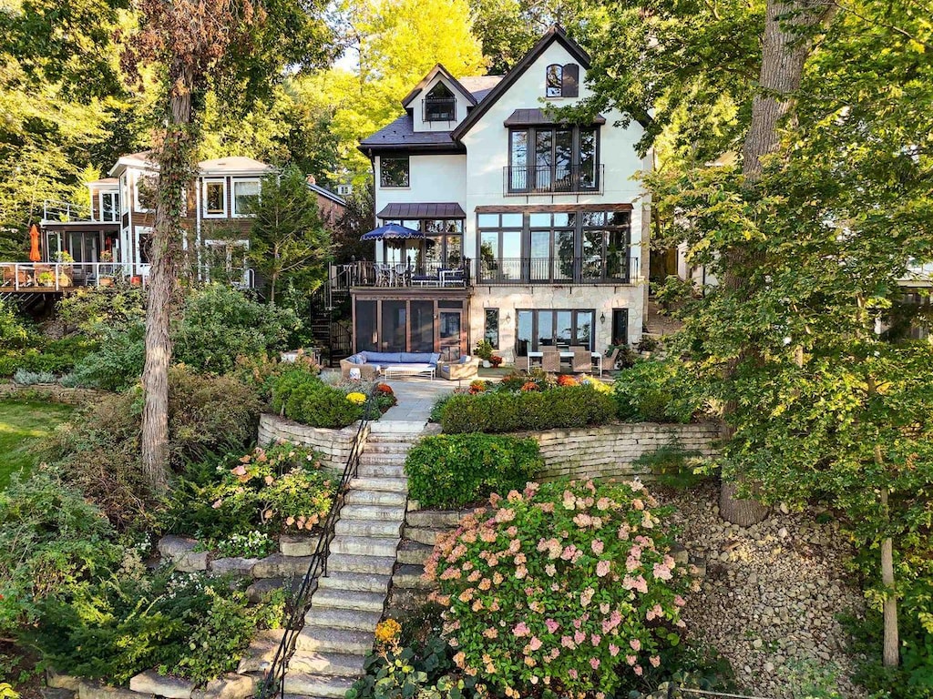 3414 Lake Mendota Dr, Madison, WI 53705 - back of house with a patio, stairway, and stucco siding
