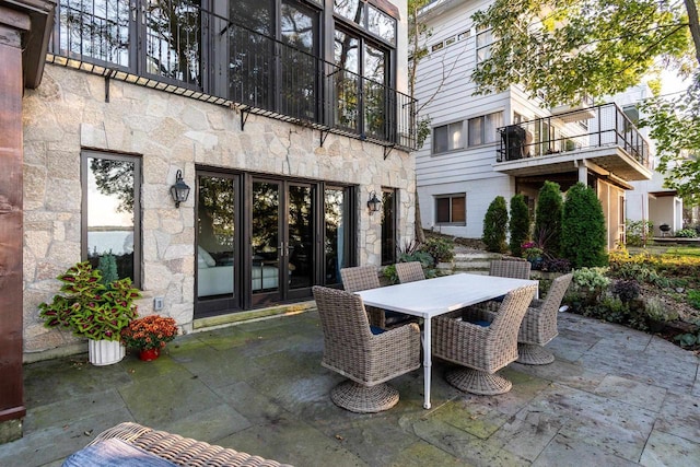 view of patio with outdoor dining area and french doors