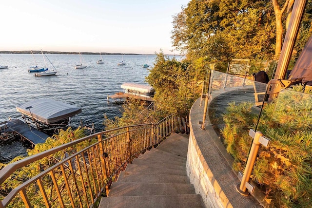 property view of water with boat lift and a dock