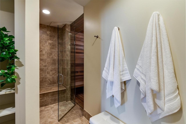 bathroom with recessed lighting and tiled shower