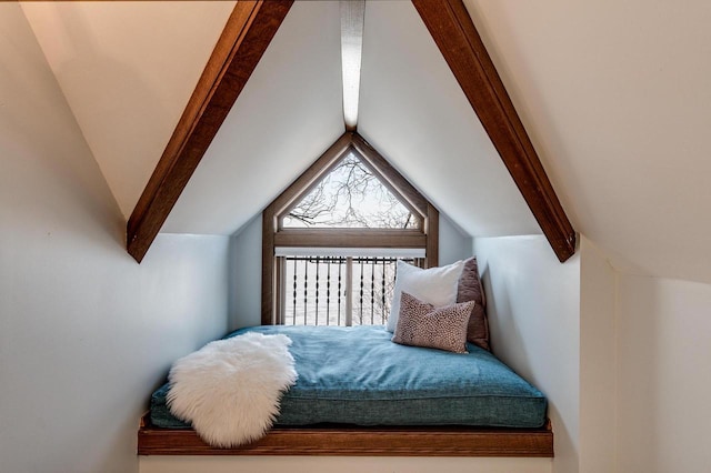 bedroom with lofted ceiling with beams