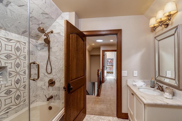 bathroom featuring enclosed tub / shower combo and vanity