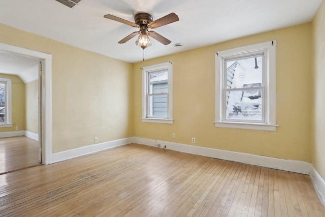 spare room featuring light hardwood / wood-style floors and ceiling fan