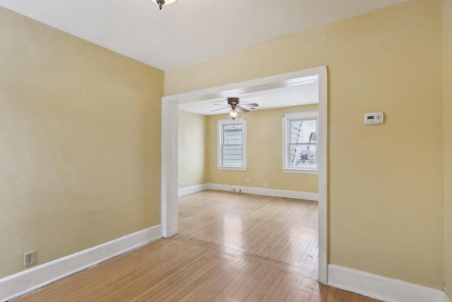 unfurnished room with hardwood / wood-style flooring and ceiling fan