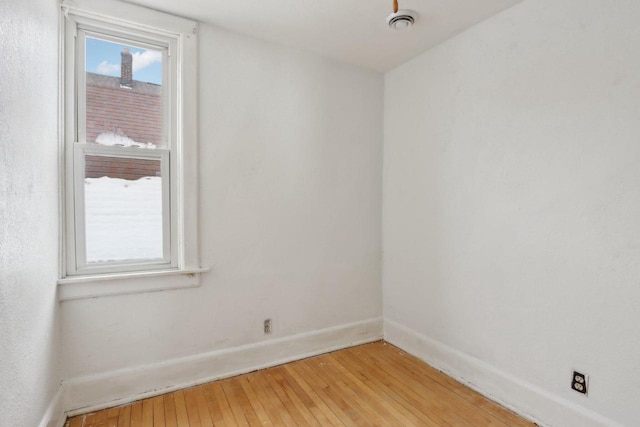 empty room with light hardwood / wood-style floors