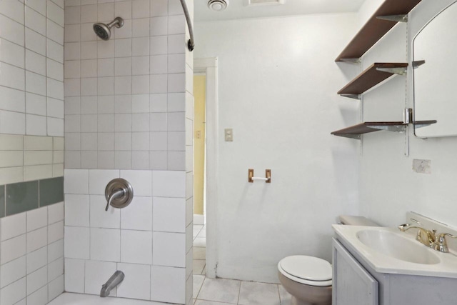 full bathroom with tiled shower / bath combo, toilet, and vanity