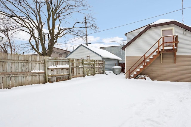 view of yard layered in snow
