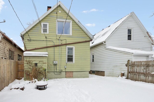 view of snow covered house