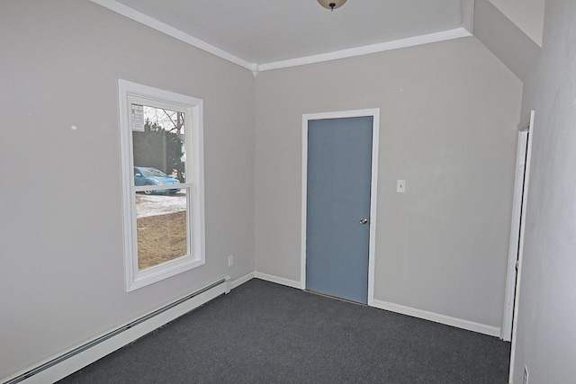 unfurnished room featuring dark carpet, a baseboard heating unit, and crown molding