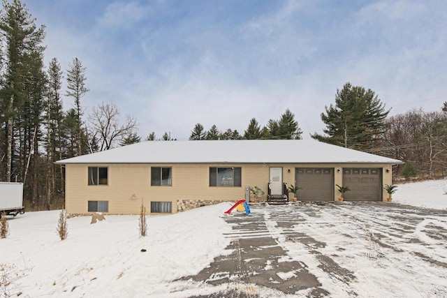 ranch-style house featuring a garage