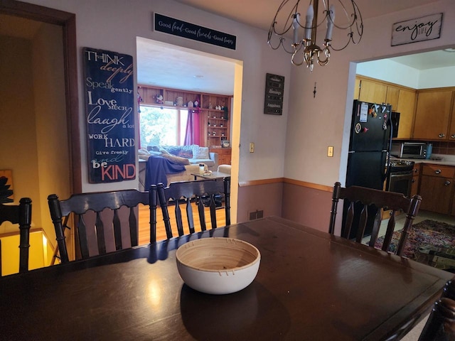 dining area featuring a chandelier