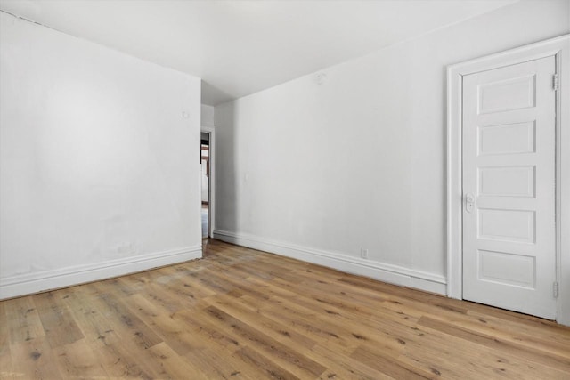 unfurnished room with light hardwood / wood-style flooring