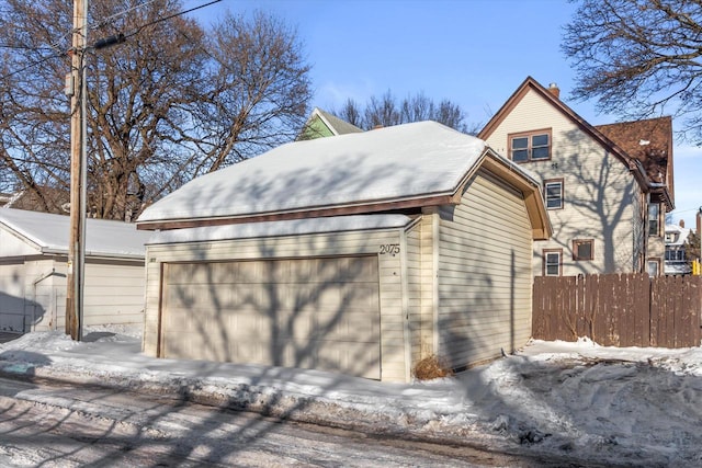 view of snow covered garage