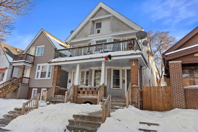 view of front of house featuring a balcony and a porch