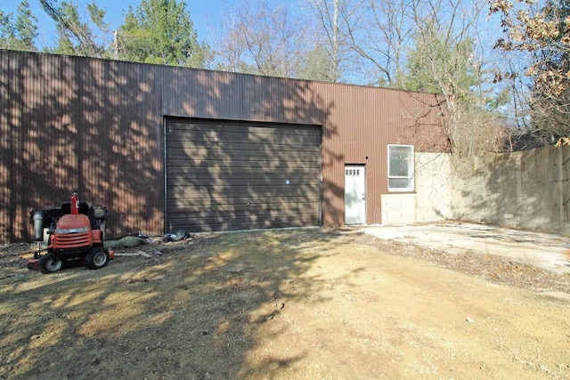 view of outbuilding with an outdoor structure and dirt driveway