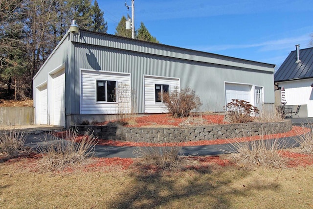 back of property with a garage