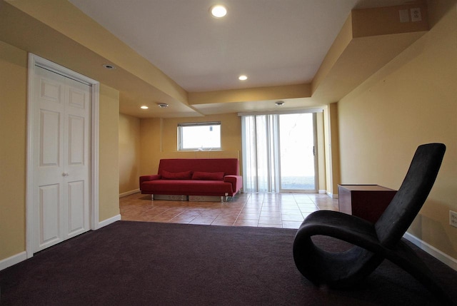 sitting room with recessed lighting, baseboards, and light colored carpet