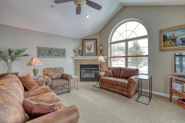 living room with light colored carpet, lofted ceiling, a fireplace, and a wealth of natural light