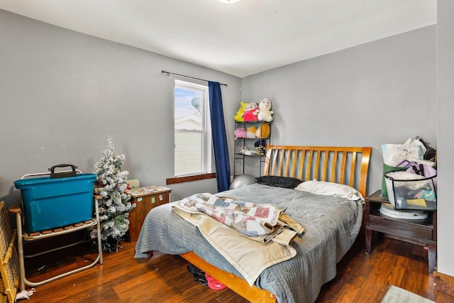 bedroom featuring dark hardwood / wood-style flooring