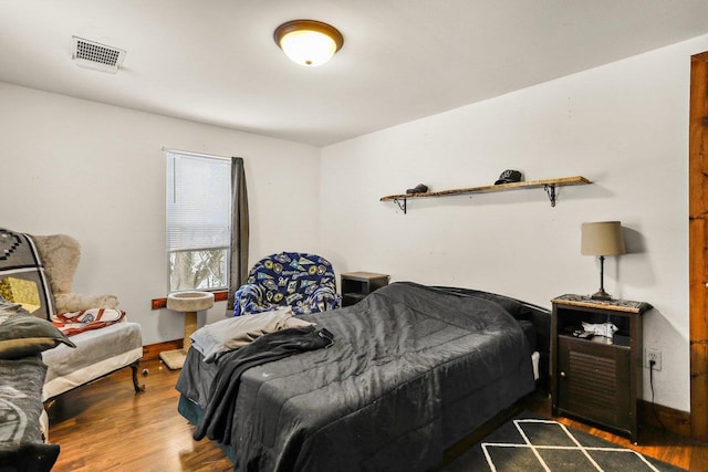 bedroom with wood-type flooring