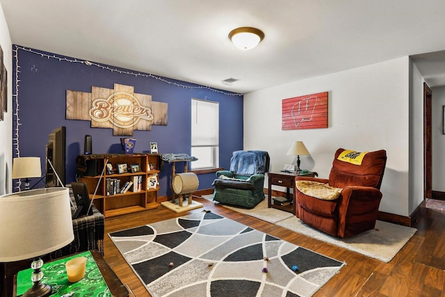 sitting room featuring hardwood / wood-style floors