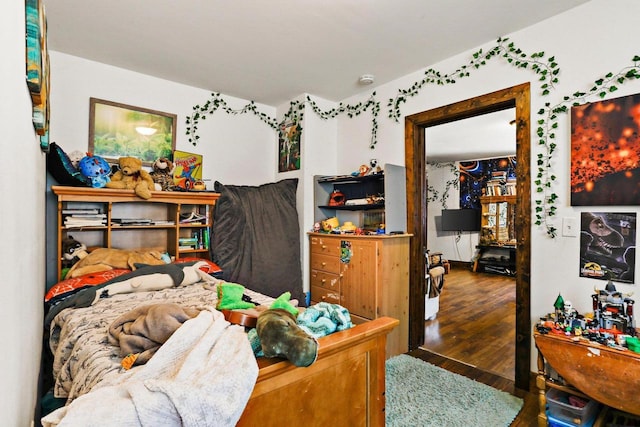 bedroom featuring dark hardwood / wood-style flooring