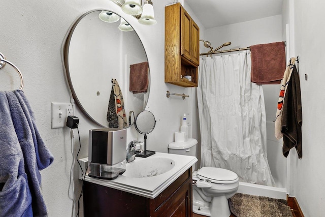 bathroom with a shower with curtain, vanity, and toilet