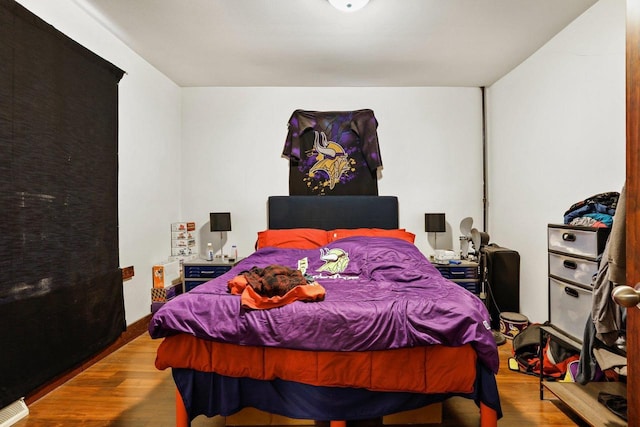 bedroom with light wood-type flooring