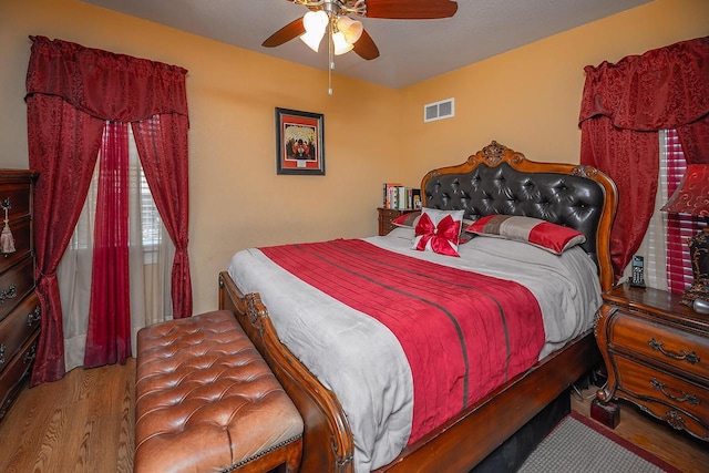 bedroom featuring ceiling fan and light hardwood / wood-style flooring