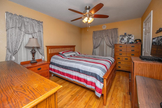 bedroom featuring ceiling fan and wood-type flooring