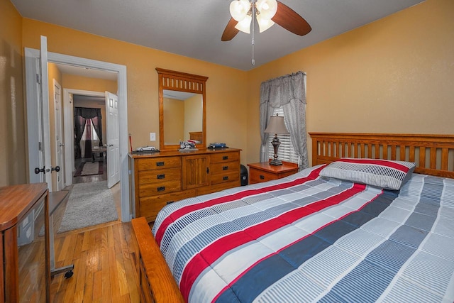 bedroom featuring hardwood / wood-style flooring and ceiling fan