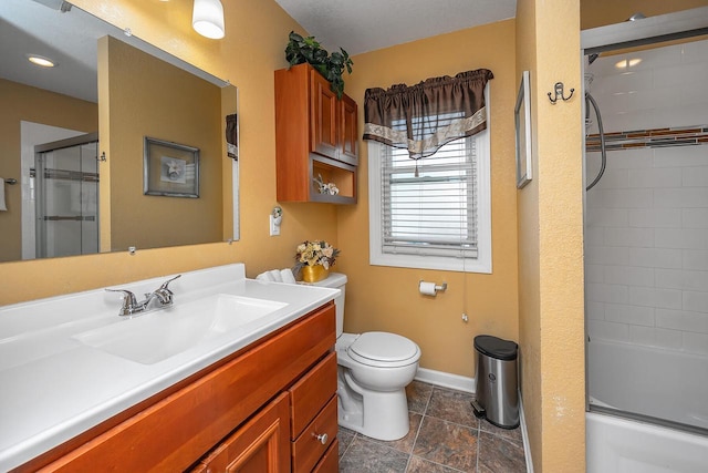 full bathroom featuring toilet, vanity, and bath / shower combo with glass door