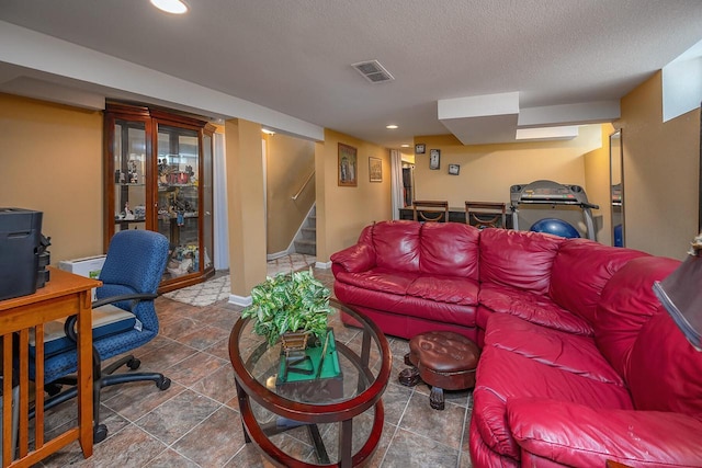 living room with a textured ceiling