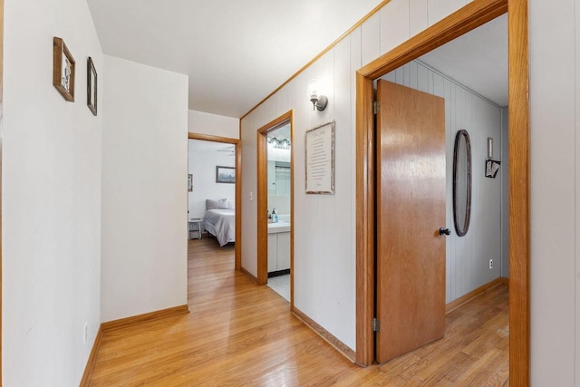 corridor with light wood-type flooring