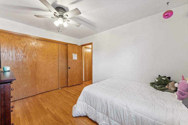 bedroom with ceiling fan and light hardwood / wood-style flooring