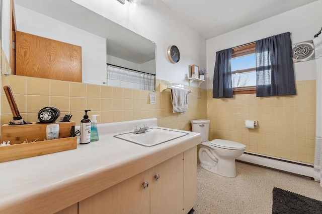 bathroom featuring vanity, a baseboard radiator, tile walls, and toilet