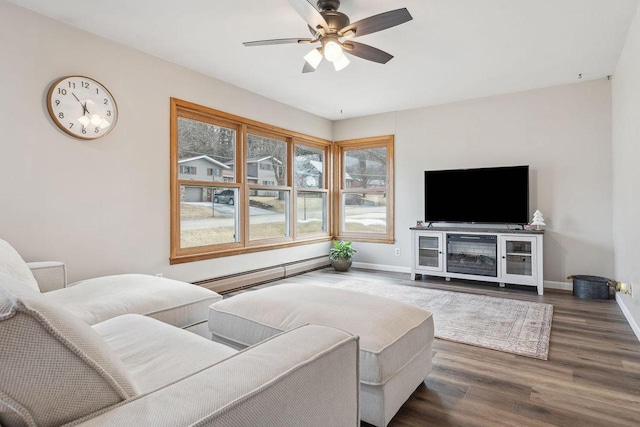 living room featuring ceiling fan, a baseboard radiator, and dark hardwood / wood-style flooring