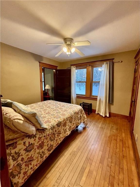 bedroom featuring ceiling fan and light wood-type flooring