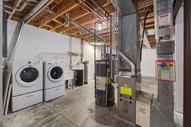 basement with washer and dryer and water heater