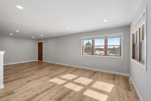 spare room featuring light hardwood / wood-style flooring