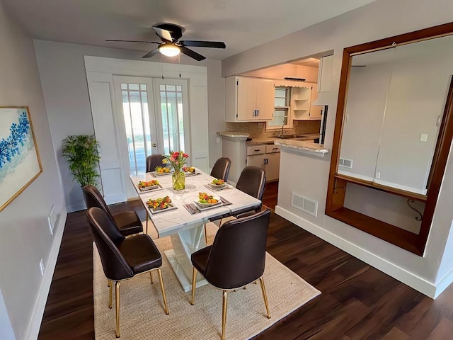 dining room featuring french doors, ceiling fan, dark hardwood / wood-style floors, and sink