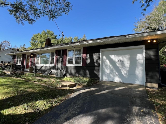 single story home with a garage