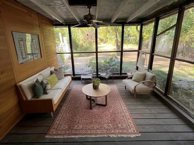 sunroom featuring ceiling fan