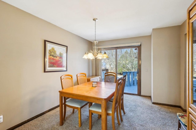 dining room featuring an inviting chandelier and carpet flooring