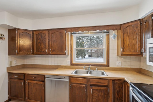 kitchen with sink, backsplash, and dishwasher