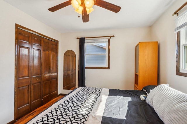 bedroom with ceiling fan and wood-type flooring